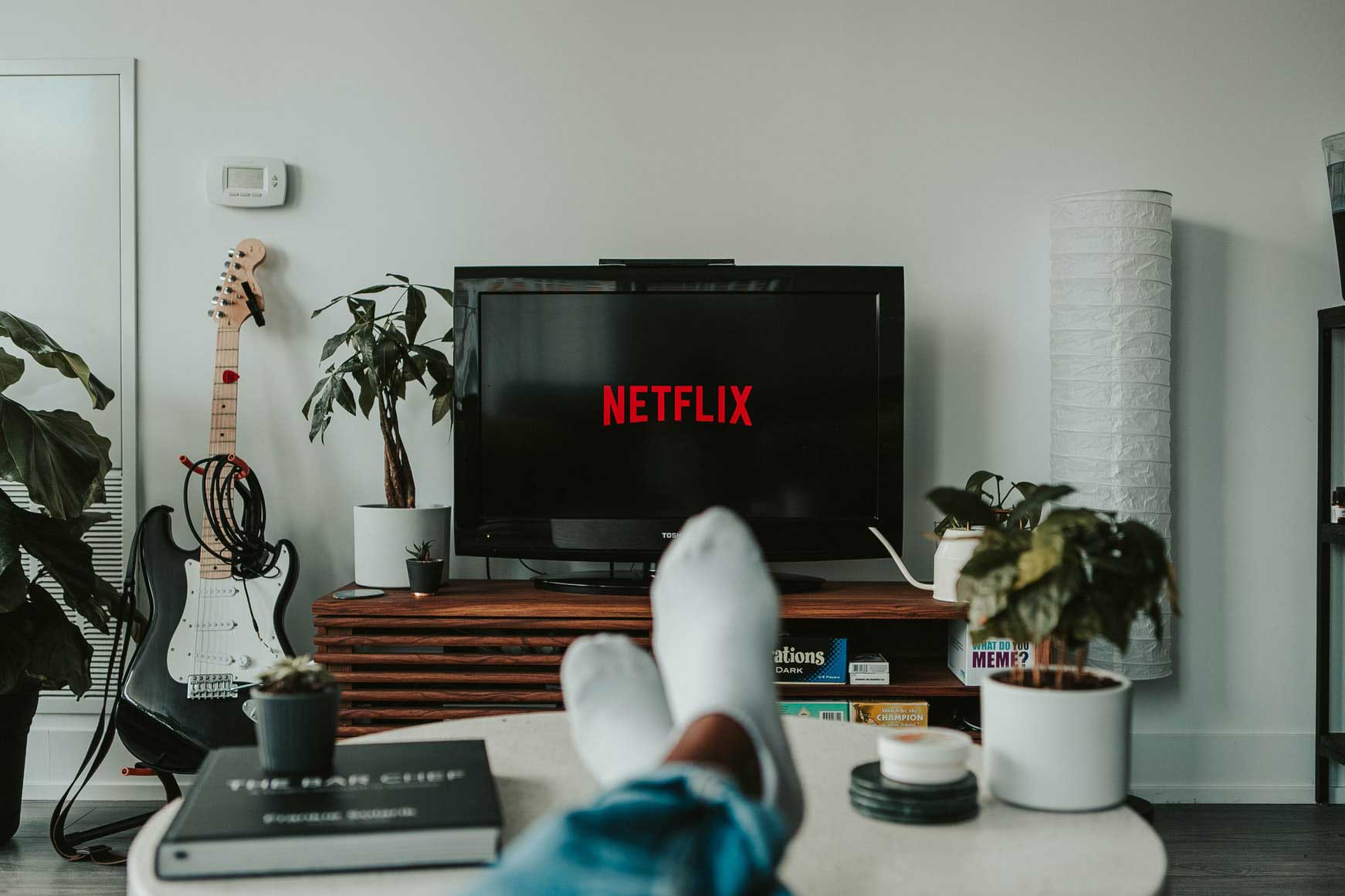 A photo of a person watching Netflix on their TV.