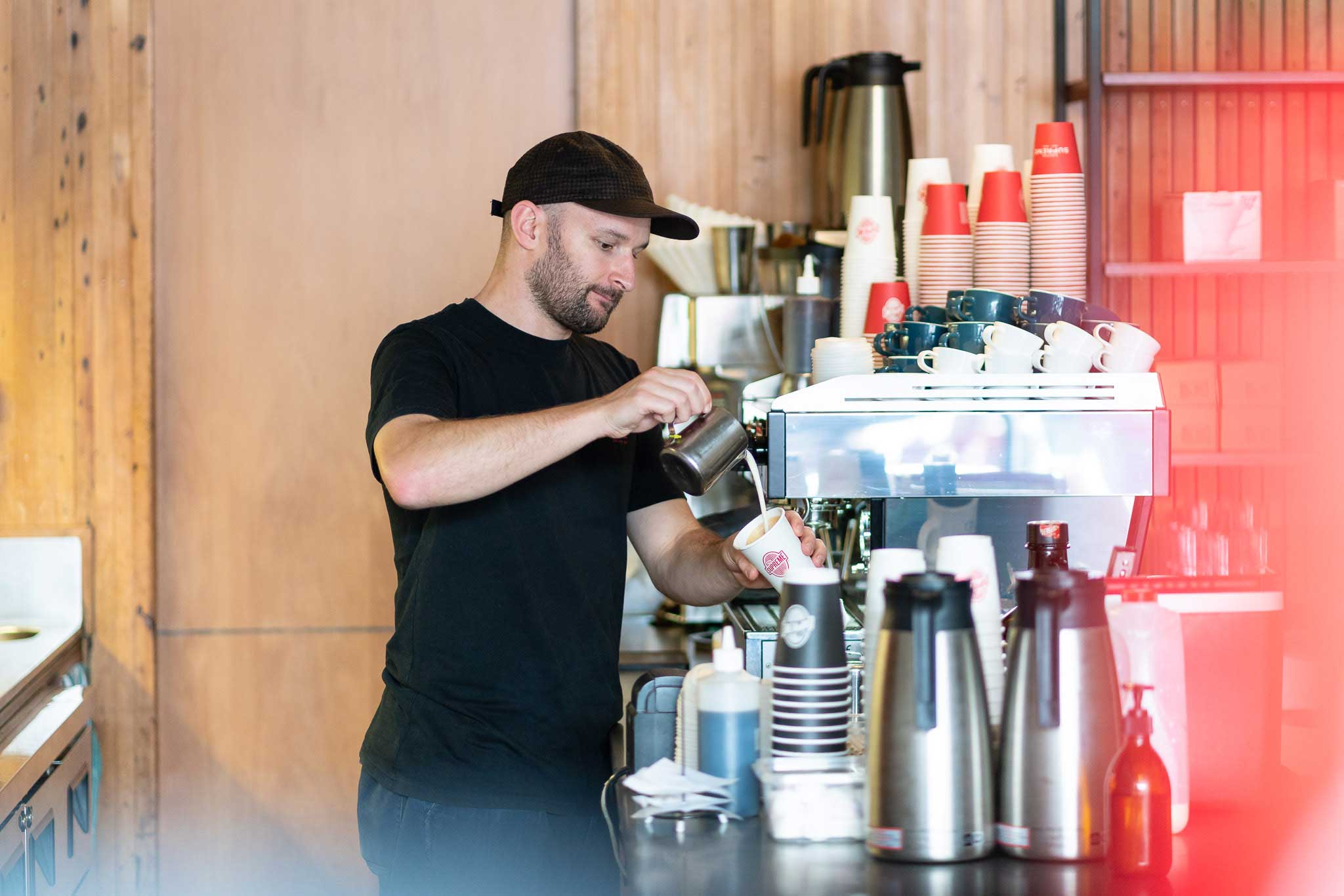 Tim pouring coffee at Customs.