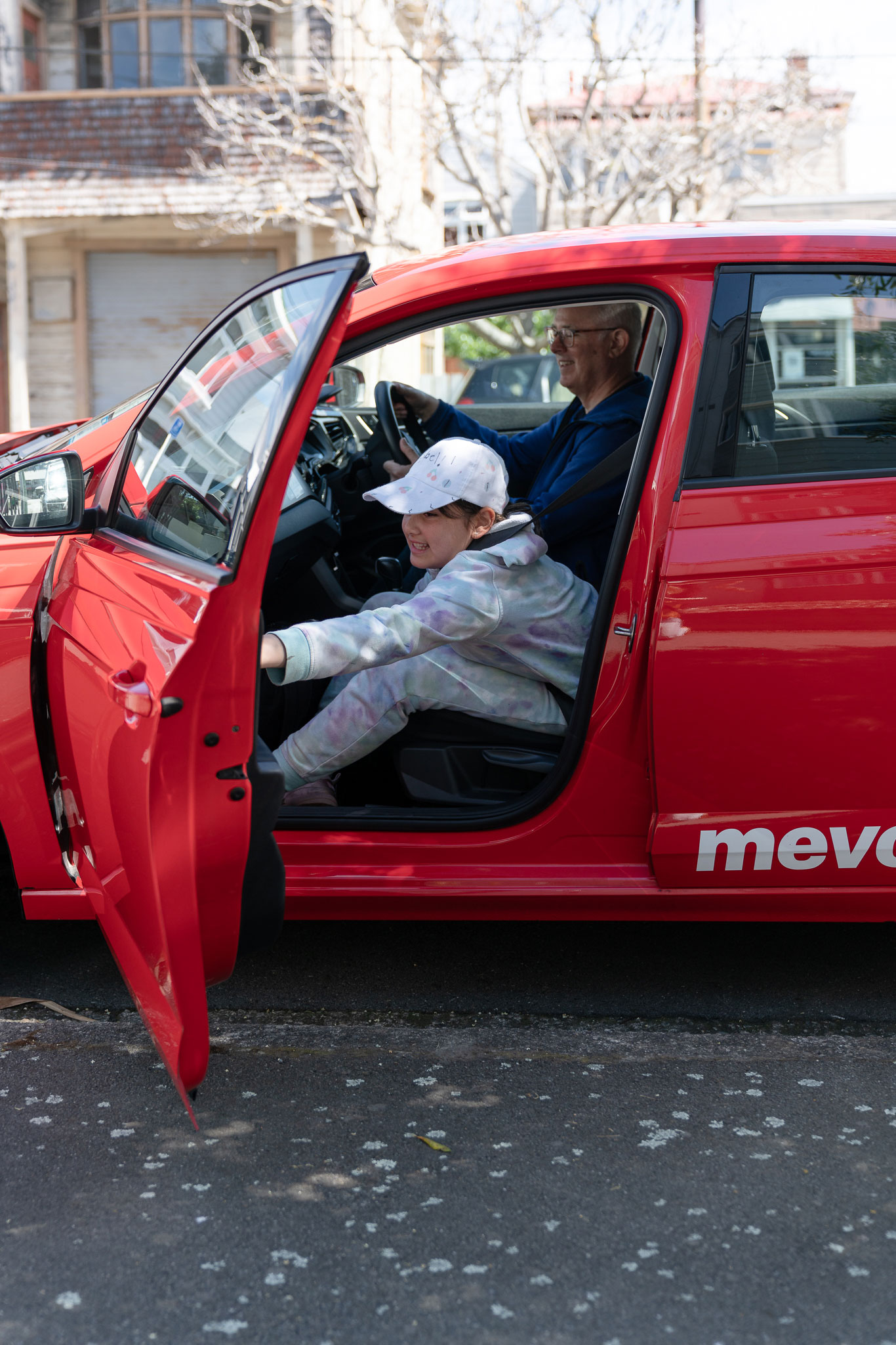 Donald and his daughter getting into a Mevo.