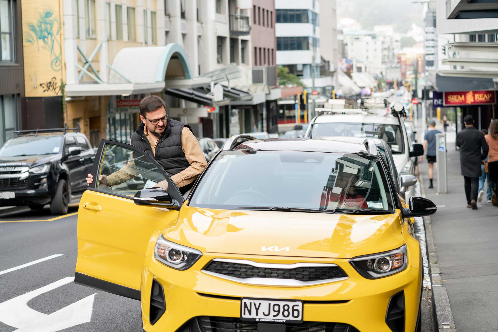 Jason getting into a Mevo car in Central Wellington.