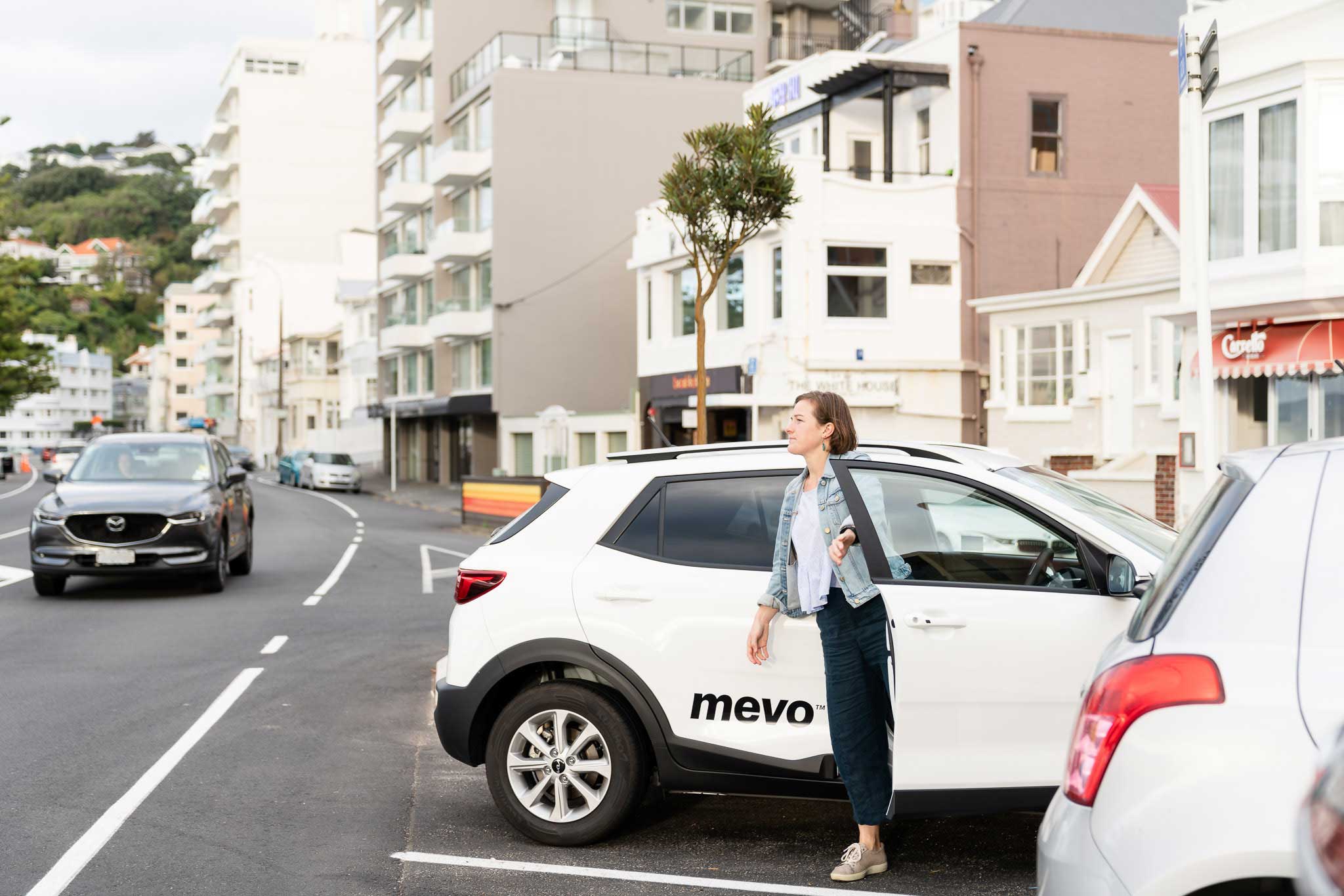 Ursula getting out of a Mevo car in Oriental Bay, Wellington.