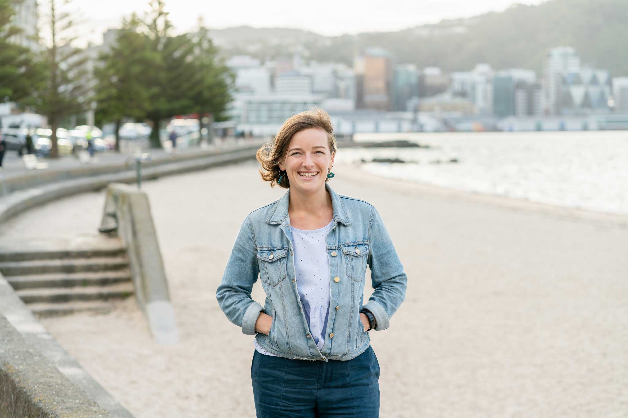 Ursula standing in front of Oriental Bay Beach in Wellington.